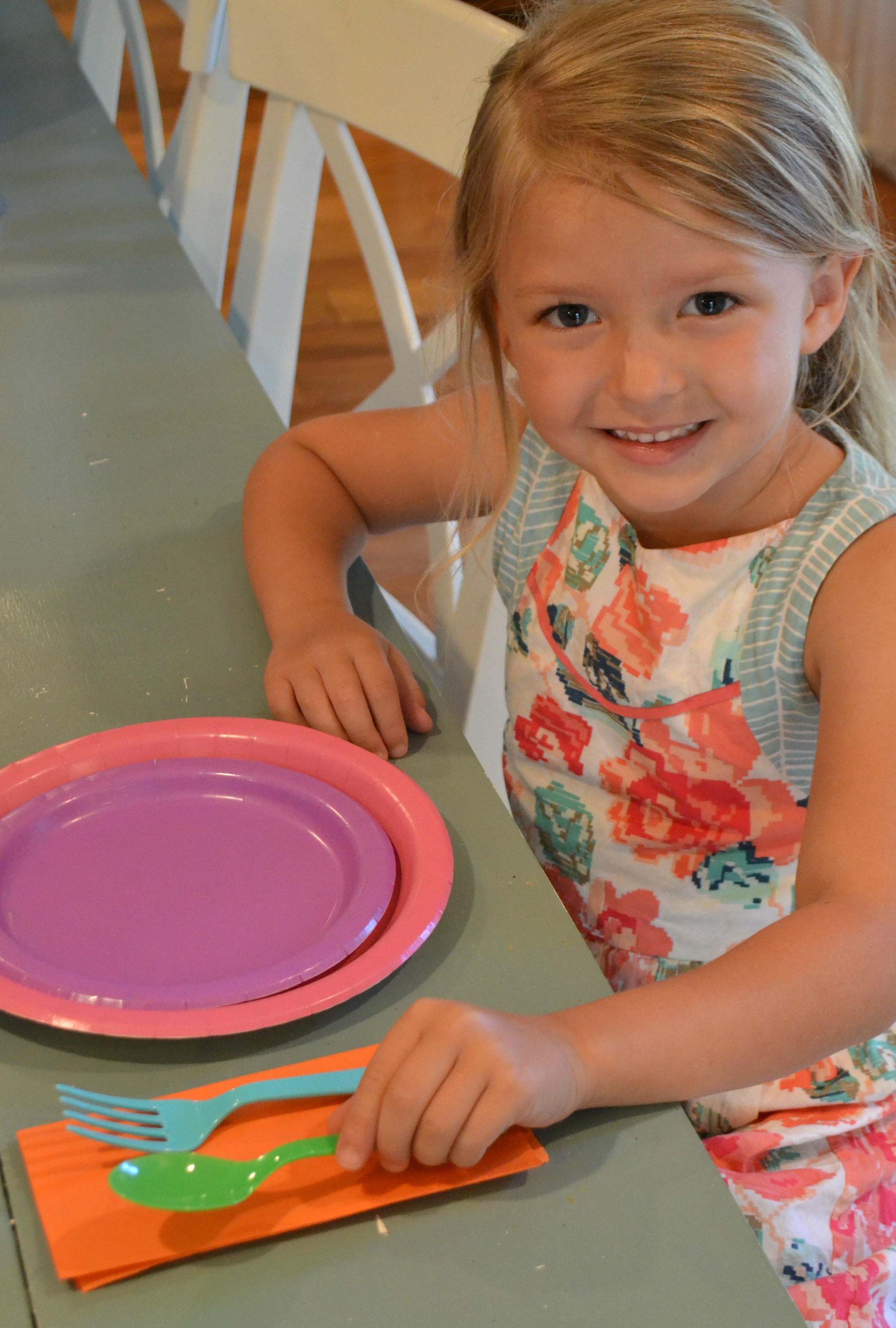 child setting the table